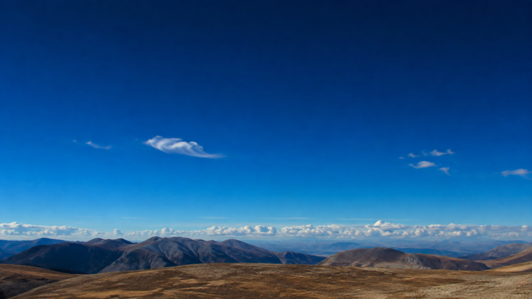 Clear blue daytime sky showing atmospheric scattering.